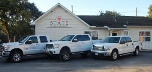 State Roofing Trucks parked at Headquarters
