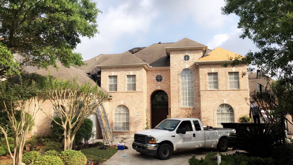 Roof on home before roof replacement from hail and wind damage.